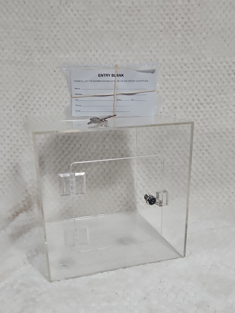 9"x9" cube clear acrylic "raffle" box with lockable door & keys; lots entry form